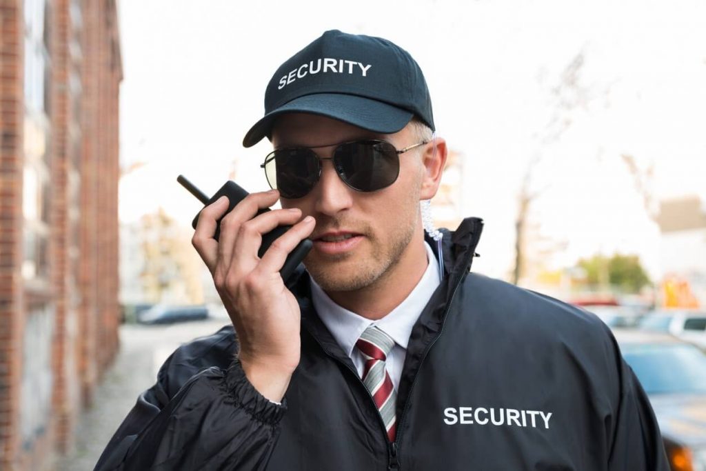 security guard talking on a walkie-talkie